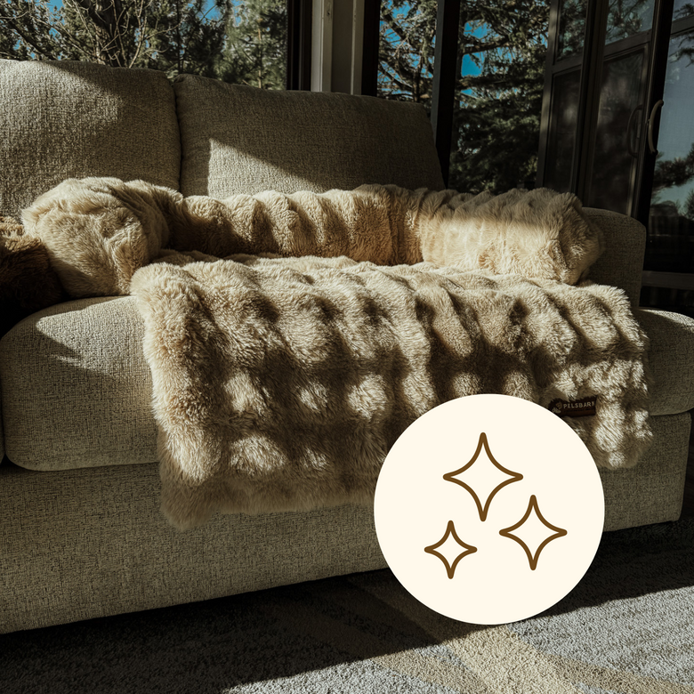A Pelsbarn cover over a sofa in a bright room