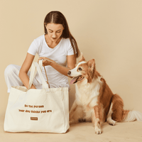 'Be the person your dog thinks you are' Tote Bag